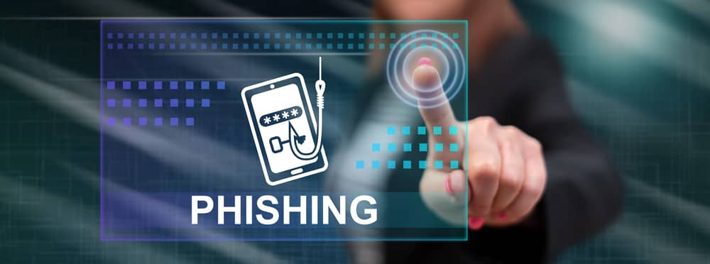 Imagen de una mano interactuando con una pantalla digital que muestra el término "Phishing", ilustrando una guía sobre cómo proteger una empresa de ataques de spear phishing.