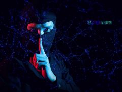 Hacker haciendo un gesto de silencio para representar un ataque ultrasónico inaudible.