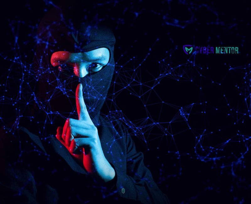 Hacker haciendo un gesto de silencio para representar un ataque ultrasónico inaudible.